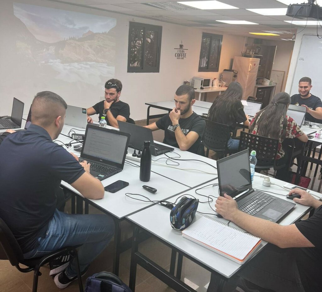 Israeli Arab tech students participating in technical skills training.