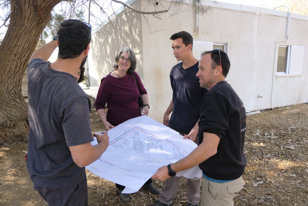 The school's leaders show the plans for the continued building and expansion of the facilities.